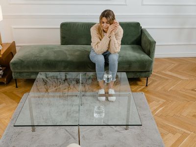 Woman drinking water after a wellness session.